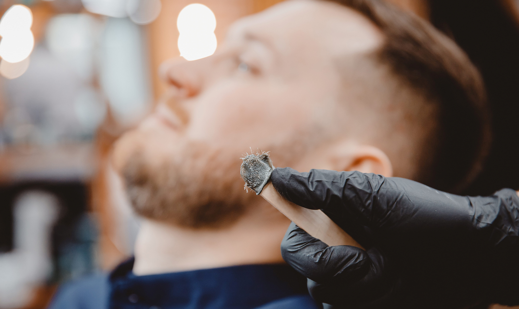 Nose waxing at a barbershop